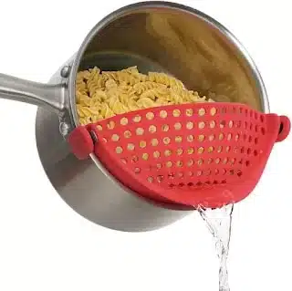 Straining pasta made easy with a clip-on strainer.