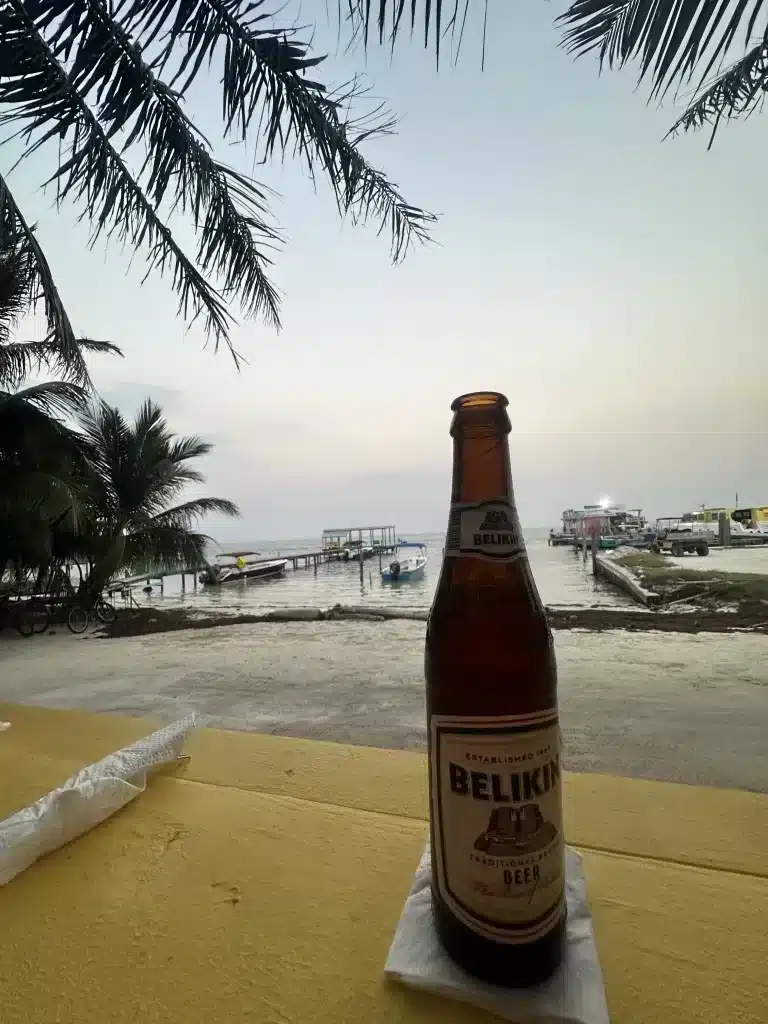 Enjoying a Belikan in Caye Caulker.