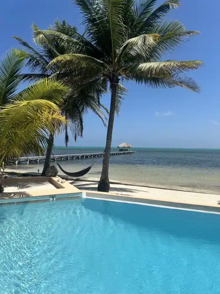 By the pool at Casa Redonda, overlooking the dock. This is an excellent choice for a vacation home rental in San Pedro, Belize.