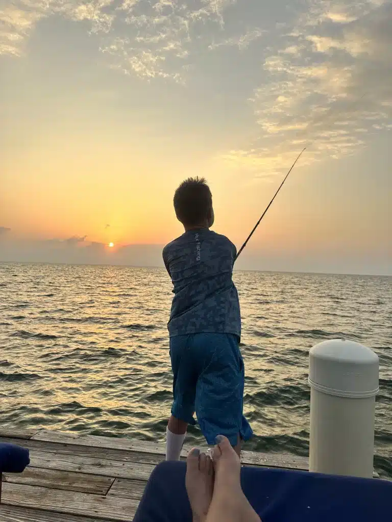 Fishing off the dock in Caye Caulker, Belize with fishing lures for bonefishng.