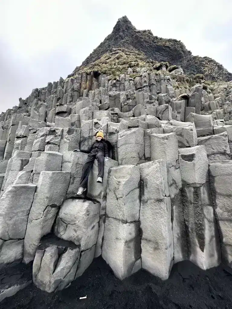 Iceland on a budget in 2024 should include the basalt columns of Black Sand Beach, which is a cheap place to visit on your itinerary.