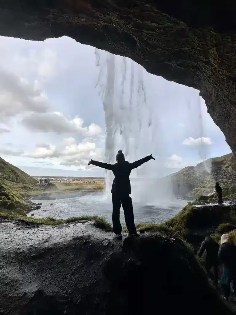 Standing behind Seljalandsfoss, one of the first waterfalls from Selfoss to Vik. 